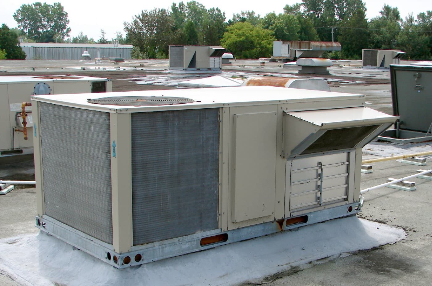 Packaged rooftop air conditioning units on a commercial roof