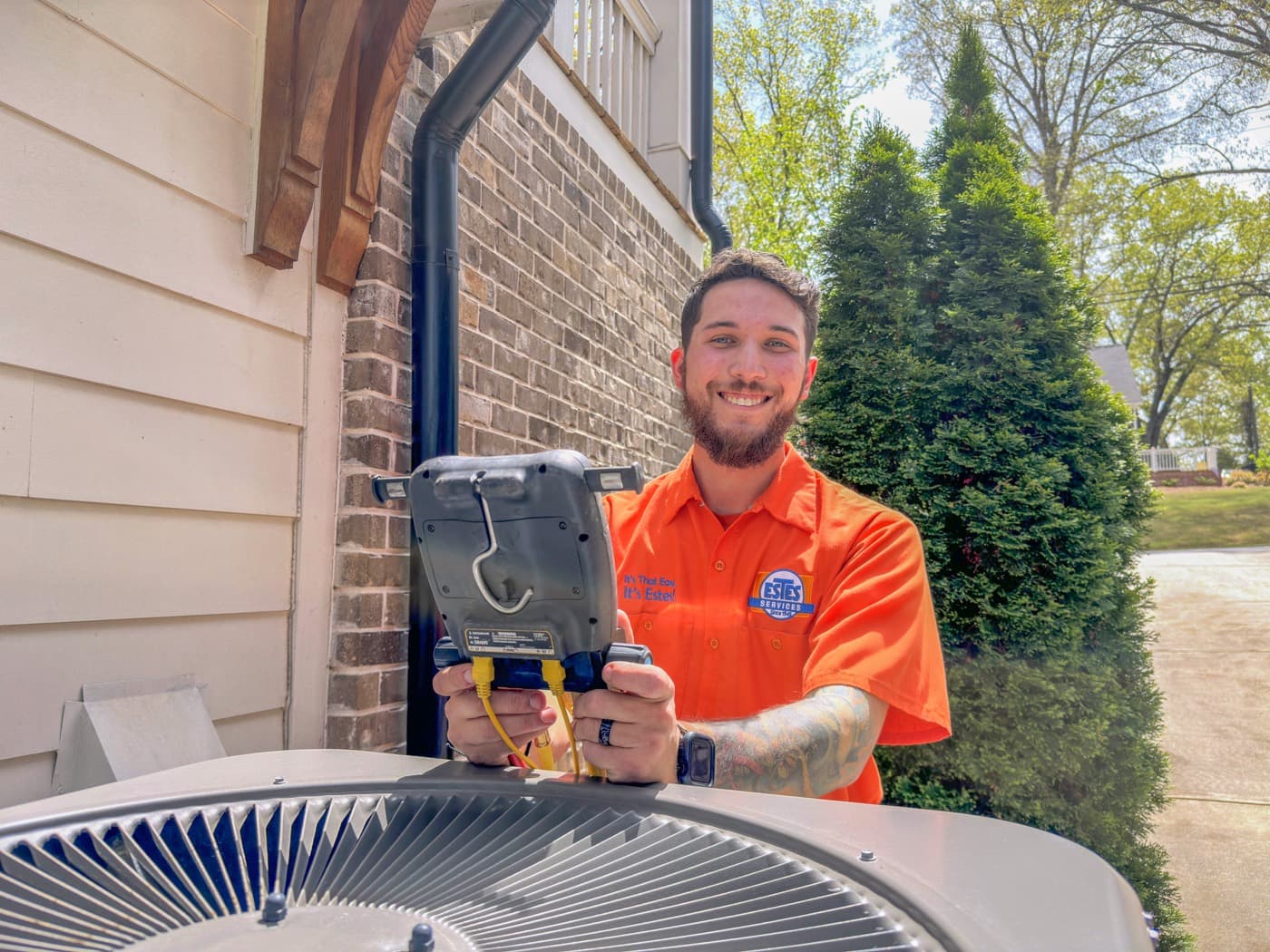 An HVAC technician servicing equipment in the field